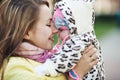 Lovely smiling mom face to face with her cute child. Royalty Free Stock Photo