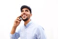 Close up happy young North African man talking on mobile phone Royalty Free Stock Photo