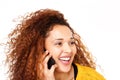 Close up happy young woman talking on mobile phone against isolated white background Royalty Free Stock Photo