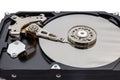 Close up of hard disk hard disk magnetic tape inside, open cover hard disk in computer or server on white background. Royalty Free Stock Photo