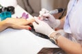 Close-up hardware manicure in salon. Removal of old gel varnish. Royalty Free Stock Photo