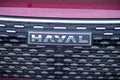 Close-up of the Haval car logo on the radiator grille