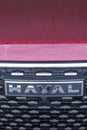 Close-up of the Haval car logo on the radiator grille