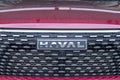 Close-up of the Haval car logo on the radiator grille