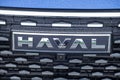 Close-up of the Haval car logo on the radiator grille