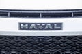 Close-up of the Haval car logo on the radiator grille