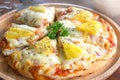 Close up of Hawaiian pizza juicy pineapple chunks ham bits melted mozzarella cheese Royalty Free Stock Photo