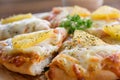 Close up of Hawaiian pizza juicy pineapple chunks ham bits melted mozzarella cheese Royalty Free Stock Photo