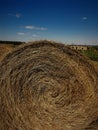 Close up of hay bale, bright  blue sky Royalty Free Stock Photo