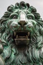 Close up of the head of a bronze sculpture of lion Royalty Free Stock Photo