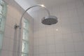 close up on head, rain shower in modern bathroom with white tiles stylish new design Royalty Free Stock Photo