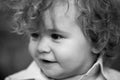 Close up head shot of baby. Kids face, little boy portrait. Smiling infant, cute smile.