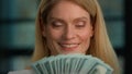 Close up head shot Caucasian 40s woman middle-aged adult businesswoman rich female holding fan counting money check Royalty Free Stock Photo