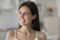 Close up head shot happy beautiful woman staring into distance