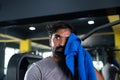 close up head shot of Hard working Indian young bodybuilder relaxing by washing sweat after heavy exercising at gym - Royalty Free Stock Photo