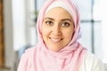 A close up head shot portrait of smiling Arabian woman in hijab Royalty Free Stock Photo