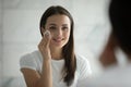 Close up head shot woman removing makeup, using cotton pad Royalty Free Stock Photo