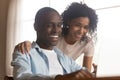 Close up head shot young mixed race family couple watching comedian movie. Royalty Free Stock Photo