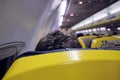 Close up head of tourist and interior view of boy or man sitting on airplane enjoying his trip - travel concept Royalty Free Stock Photo