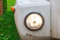 Close up of the headlight of an old abandoned truck with rusted white panels Royalty Free Stock Photo