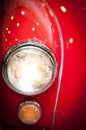 Close Up of Headlight of Red Classic Car Royalty Free Stock Photo