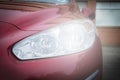 Close-up headlight of red modern car Royalty Free Stock Photo