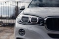 Close-up headlights of a modern white color car. Led light. Detail on the front light of a car Royalty Free Stock Photo