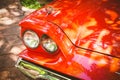 Close-up of headlights of red vintage car Royalty Free Stock Photo