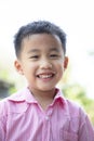 Close up headshot of cheerful asian children toothy smiling face of happiness emotion Royalty Free Stock Photo