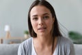 Headshot of millennial girl talking on video call