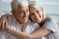 Headshot portrait of loving elderly couple hugging at home Royalty Free Stock Photo