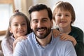 Headshot portrait of happy dad and kids hugging Royalty Free Stock Photo