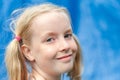 Close up headshot of pretty young girl with pigtails making eye contact Royalty Free Stock Photo