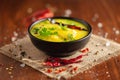 Close-up of healthy curry of yogurt and potato Dahi Aloo or Aaloo an Indian Classical dish. Served in Black bowl.