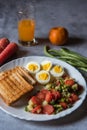 Close up of healthy food items bread slices, boiled vegetables and eggs