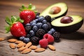 Close up healthy food selection various tasty fruits avocado strawberry assorted berry nuts seeds on rustic wooden