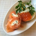 Close-up healthy smoked salmon and Salmon roe on boiled egg before starting main dish