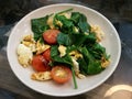 Close-up healthy stir-fry vegetable with tomato and egg for diet and detox to clean your body and shape