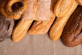 Close Up Of Heap Of Different Fresh Breads On Napkin Top View