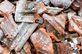 Close up of a heap of old, dirty broken roof tiles. Construction roofing industry background