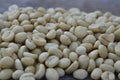 close up heap of parchment coffee on wood