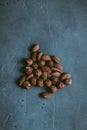 A close-up of a heap of peeled almond and hazel nuts