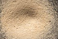 Close up of heap of sand and copy space on black background