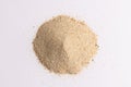 Close up of heap of sand and copy space on white background
