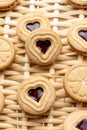 Close-up of heart-shaped cookies and strawberry jam, on a basket, for Valentine`s Day Royalty Free Stock Photo