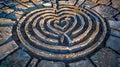 Engraved heart labyrinth design on paved surface Royalty Free Stock Photo