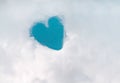 Heart shaped patterns in white fluffy clouds group on bright blue sky for background Royalty Free Stock Photo