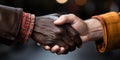 Close-up of a heartfelt handshake between two people showcasing a multicultural bond of respect and friendship