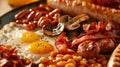 A close-up of a hearty English breakfast with eggs, sausages, bacon, beans, and mushrooms. Royalty Free Stock Photo