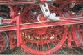 Close-up of the heavy iron wheels of a historic locomotive